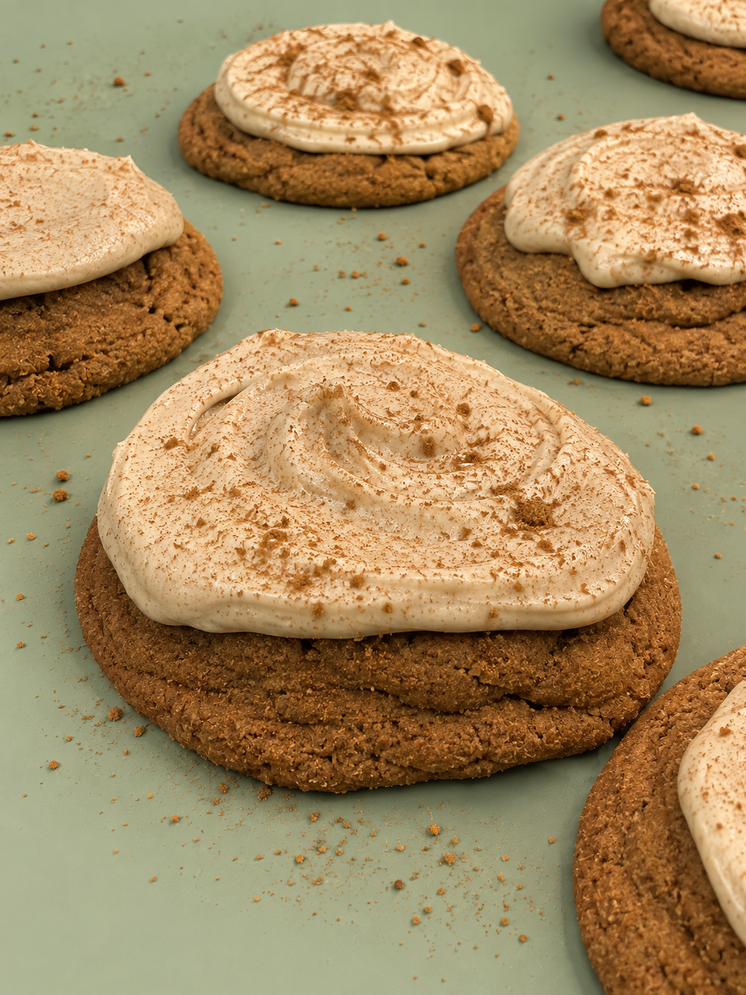 Pumpkin roll cookies topped with cinnamon cream cheese frosting